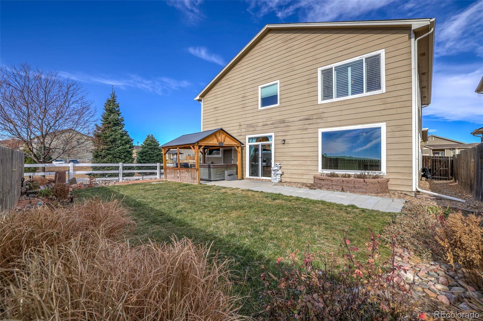 2224 Reed Grass Way Colorado Springs, CO 80915 - Photo 43 of 45 a front view of a house with garden