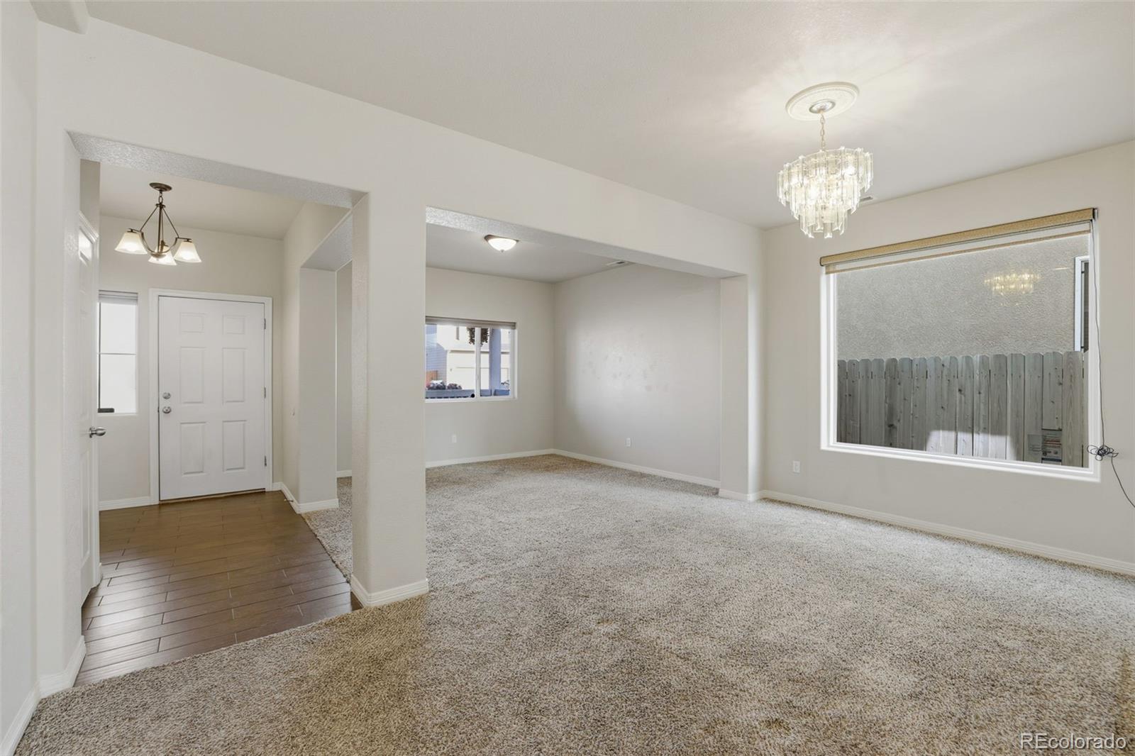 2224 Reed Grass Way Colorado Springs, CO 80915 - Photo 5 of 45 en empty room with windows and entrance