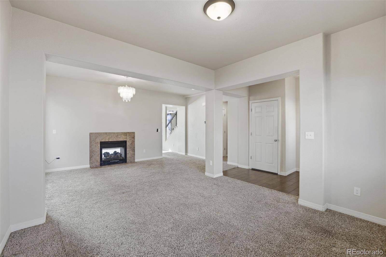 2224 Reed Grass Way Colorado Springs, CO 80915 - Photo 7 of 45 an empty room with windows
