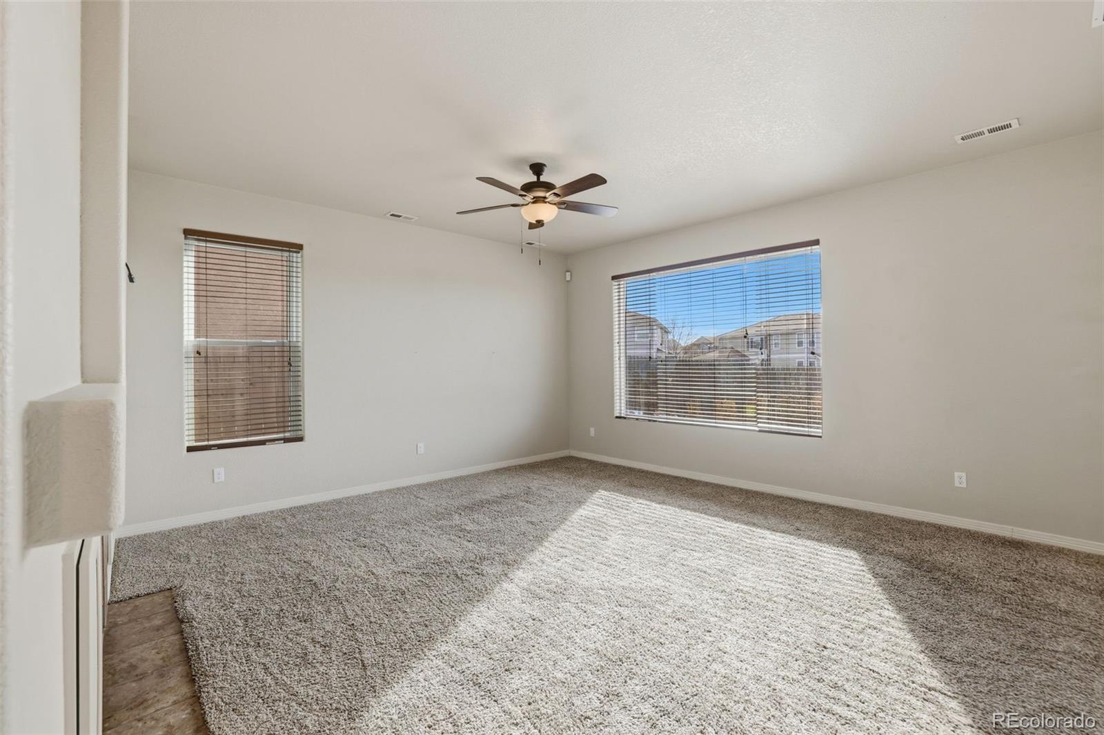 2224 Reed Grass Way Colorado Springs, CO 80915 - Photo 10 of 45 a view of an empty room with a window