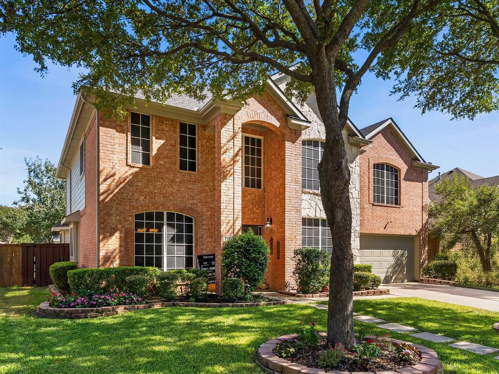 7121 Raintree Way Denton, TX 76210 - Photo 4 of 38 a front view of a house with a yard and trees