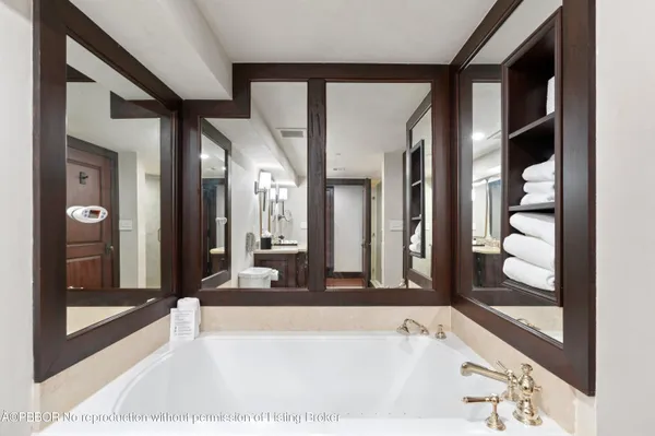 a spacious bathroom with a bathtub and a shower