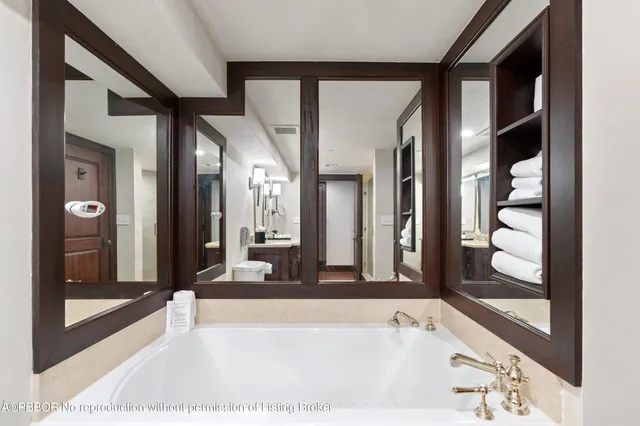 a spacious bathroom with a bathtub and a shower