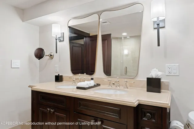 a bathroom with a sink vanity and a mirror