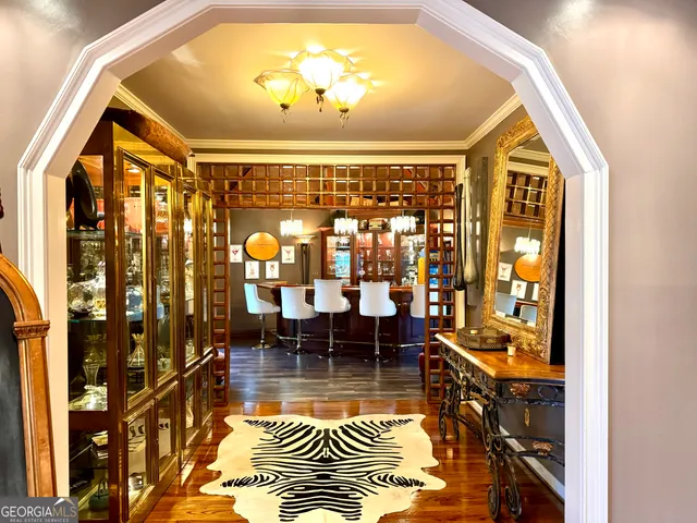 a dining room with furniture and wooden floor