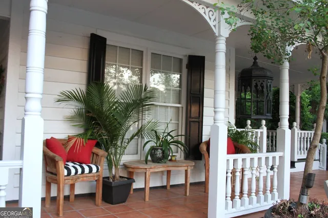 a view of balcony with furniture