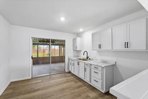 a kitchen with a sink and cabinets