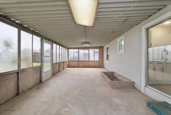 a view of an empty room and window