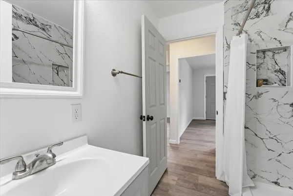 a bathroom with a sink and a mirror