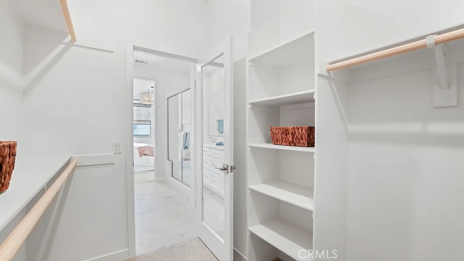 785 Walnut Terrace Montebello, CA 90640 - Photo 19 of 36 a walk in closet with view of bathroom