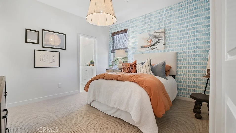 785 Walnut Terrace Montebello, CA 90640 - Photo 25 of 36 a bedroom with a bed and a chandelier
