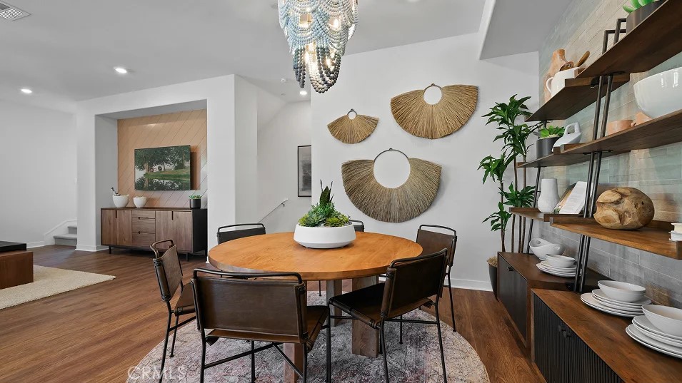 785 Walnut Terrace Montebello, CA 90640 - Photo 9 of 36 a view of a dining room with furniture and wooden floor