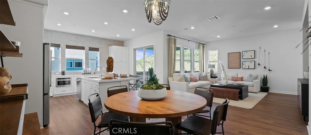 785 Walnut Terrace Montebello, CA 90640 - Photo 10 of 36 a view of a dining room with furniture window and wooden floor