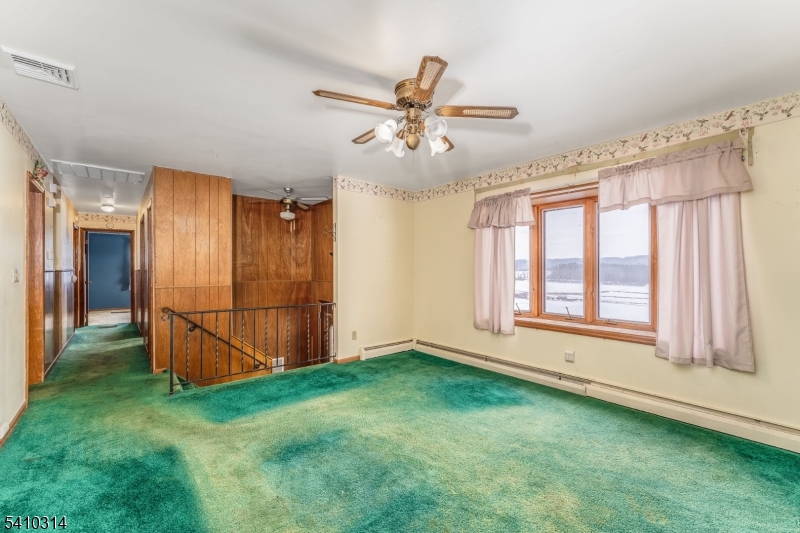 252 Mountain View Road West Asbury, NJ 08802 - Photo 8 of 28 a view of an empty room with window and cabinet