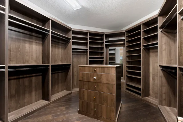 a balcony with couch and a potted plant