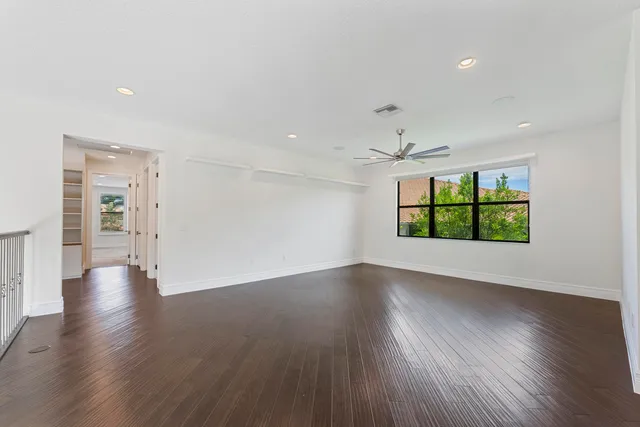 a room with furniture and wooden floor