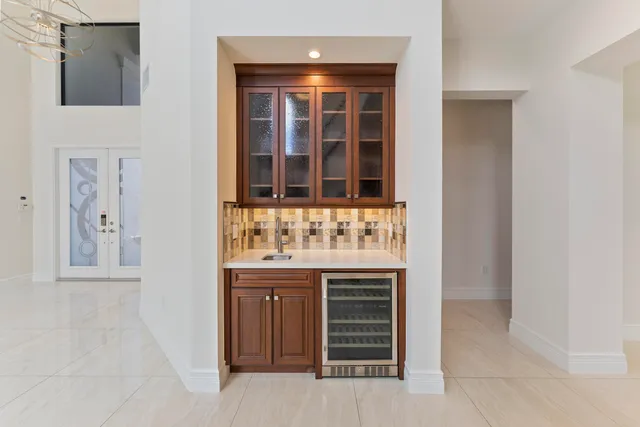 a kitchen with stainless steel appliances kitchen island a large counter space a sink and cabinets