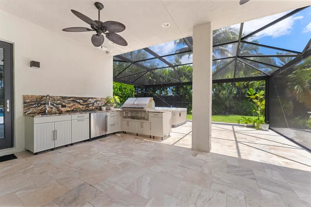 a view of house with yard and outdoor seating