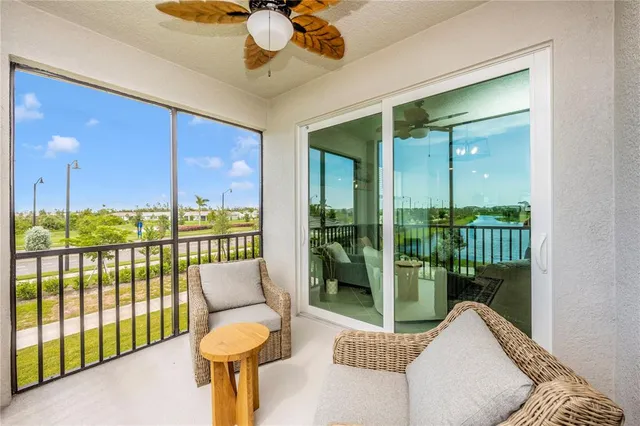 a bedroom with a bed and a flat screen tv in white walls