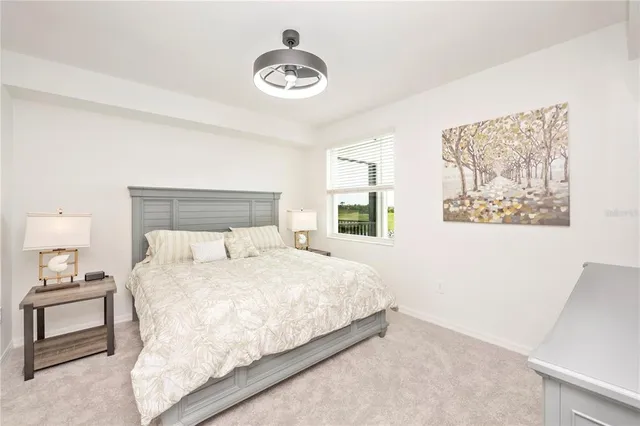 a bathroom with a granite countertop sink and a toilet