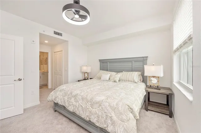 a bedroom with a bed and window