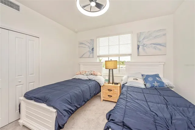a bathroom with a sink mirror vanity and toilet