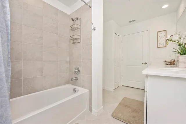 a swimming pool view with a seating space and a garden view