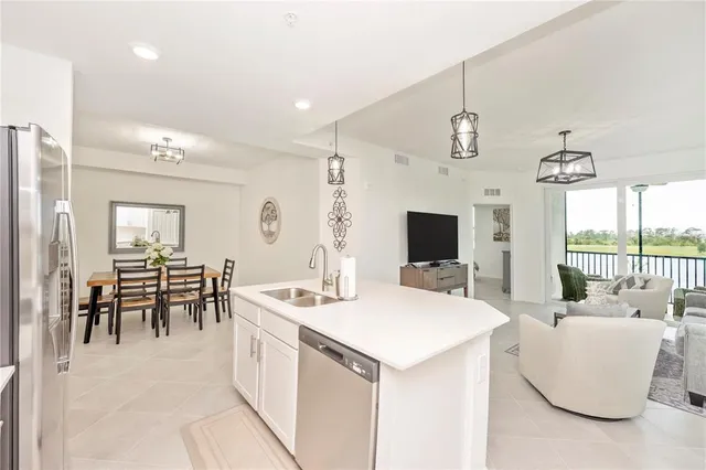 a view of a dining room with furniture and a clock