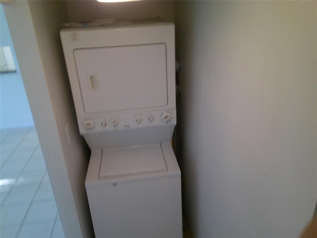 3199 Foxcroft Road, Unit 306 Miramar, FL 33025 - Photo 11 of 12 a utility room with dryer and washer