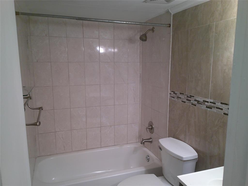 3199 Foxcroft Road, Unit 306 Miramar, FL 33025 - Photo 9 of 12 a bathroom with a toilet and shower