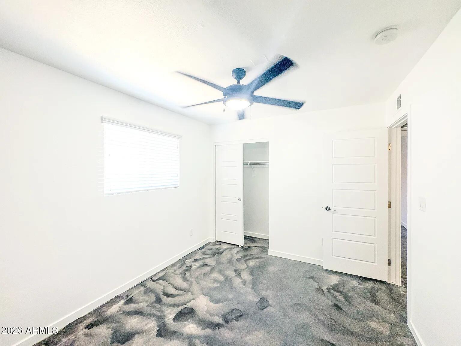4231 North 27th Street, Unit 10 Phoenix, AZ 85016 - Photo 7 of 14 a view of a big room with closet and fan