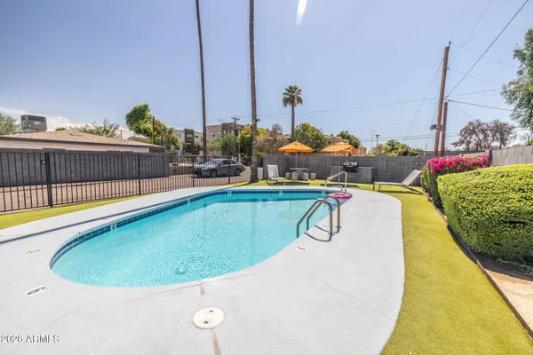 a view of swimming pool with outdoor seating