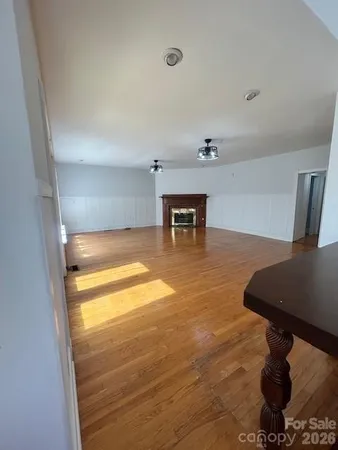 a view of a livingroom with wooden floor
