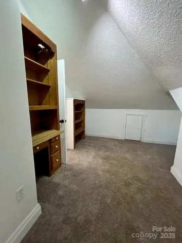 an empty room with shelves