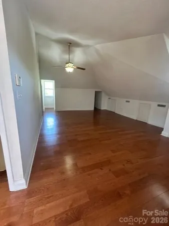 a view of a hallway with an empty room