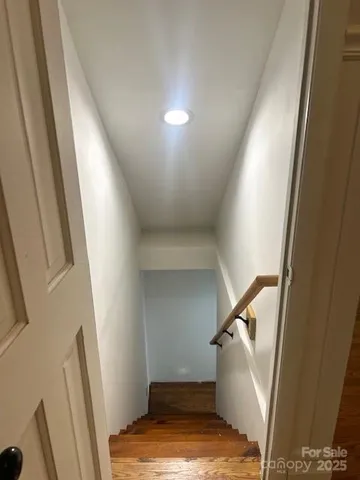 a view of deck with wooden floor and roof with a garden