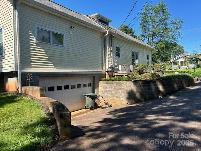 a view of backyard of house with outdoor seating