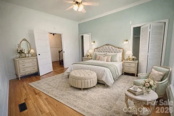 a bedroom with furniture and a chandelier