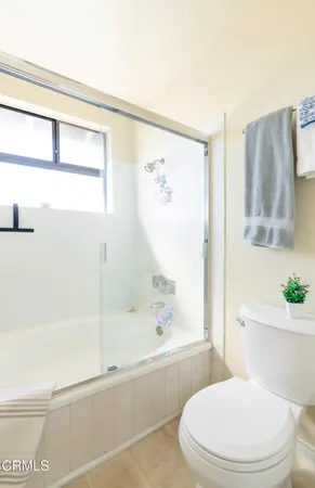 a bathroom with a bathtub and a toilet