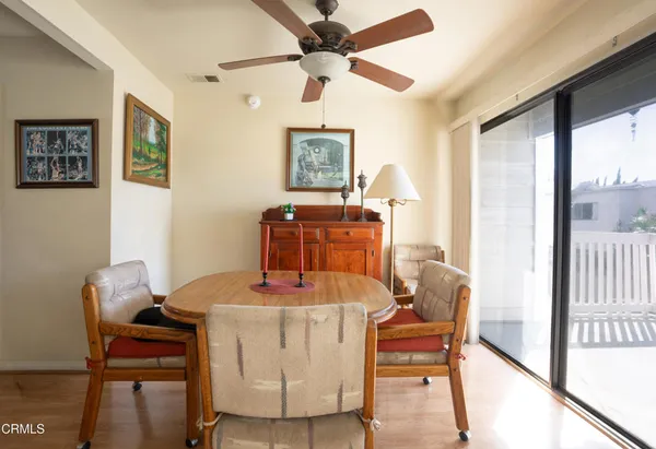 a dining room with furniture and window