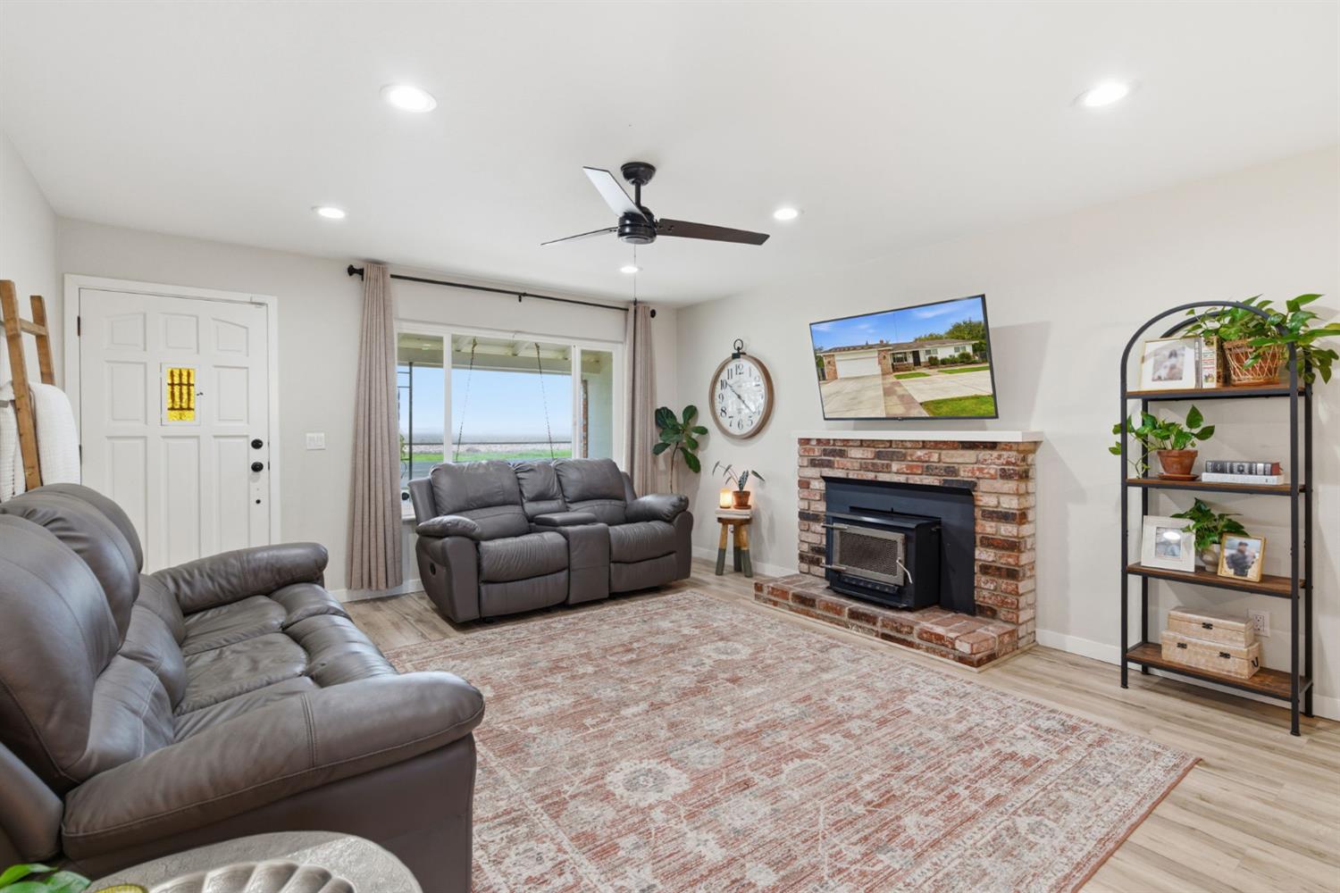 15581 French Camp Road Ripon, CA 95366 - Photo 11 of 54 a living room with furniture and a fireplace