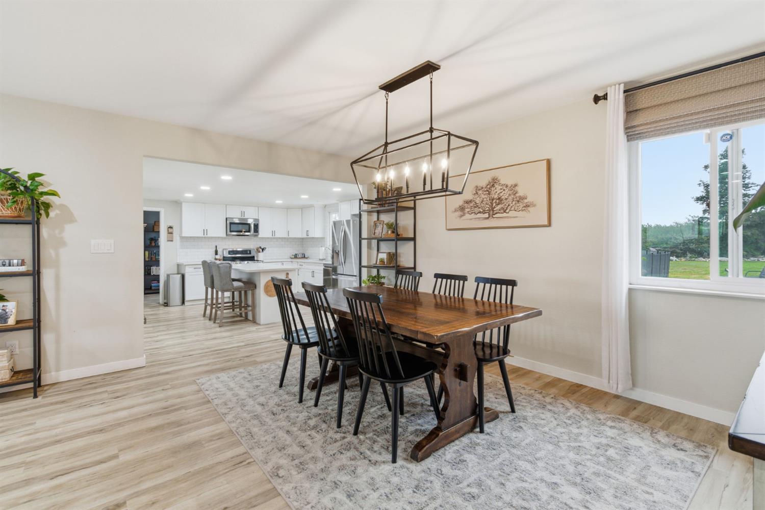 15581 French Camp Road Ripon, CA 95366 - Photo 13 of 54 a view of a dining room with furniture window and wooden floor