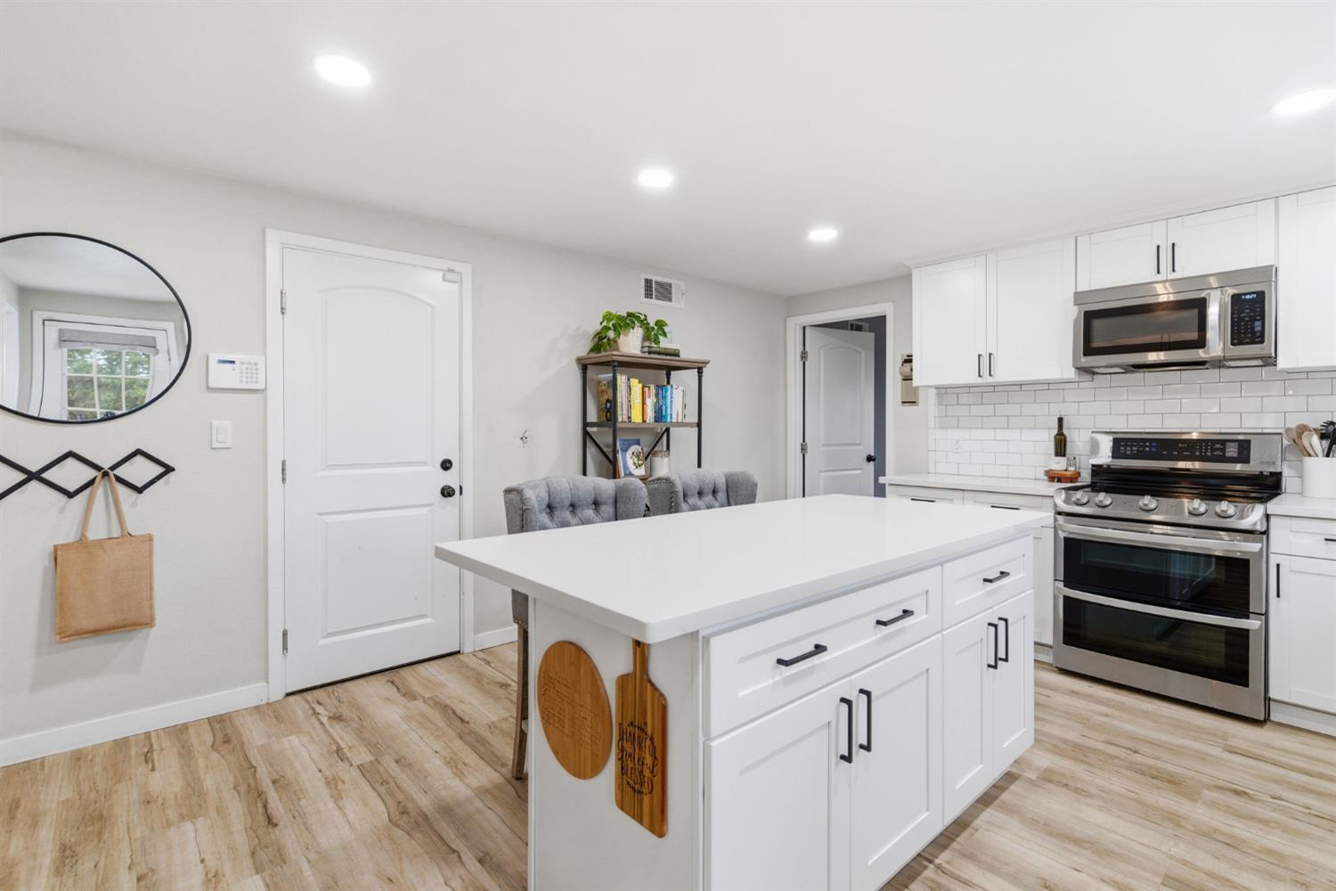 15581 French Camp Road Ripon, CA 95366 - Photo 17 of 54 a kitchen with cabinets and wooden floor