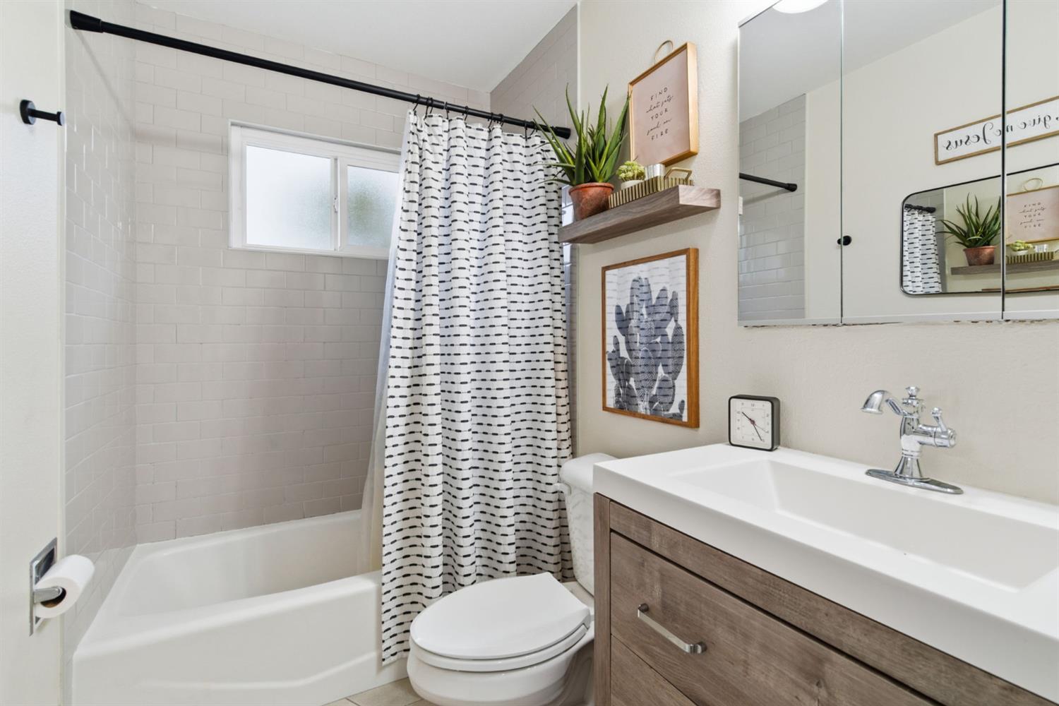 15581 French Camp Road Ripon, CA 95366 - Photo 25 of 54 a bathroom with a sink toilet and shower