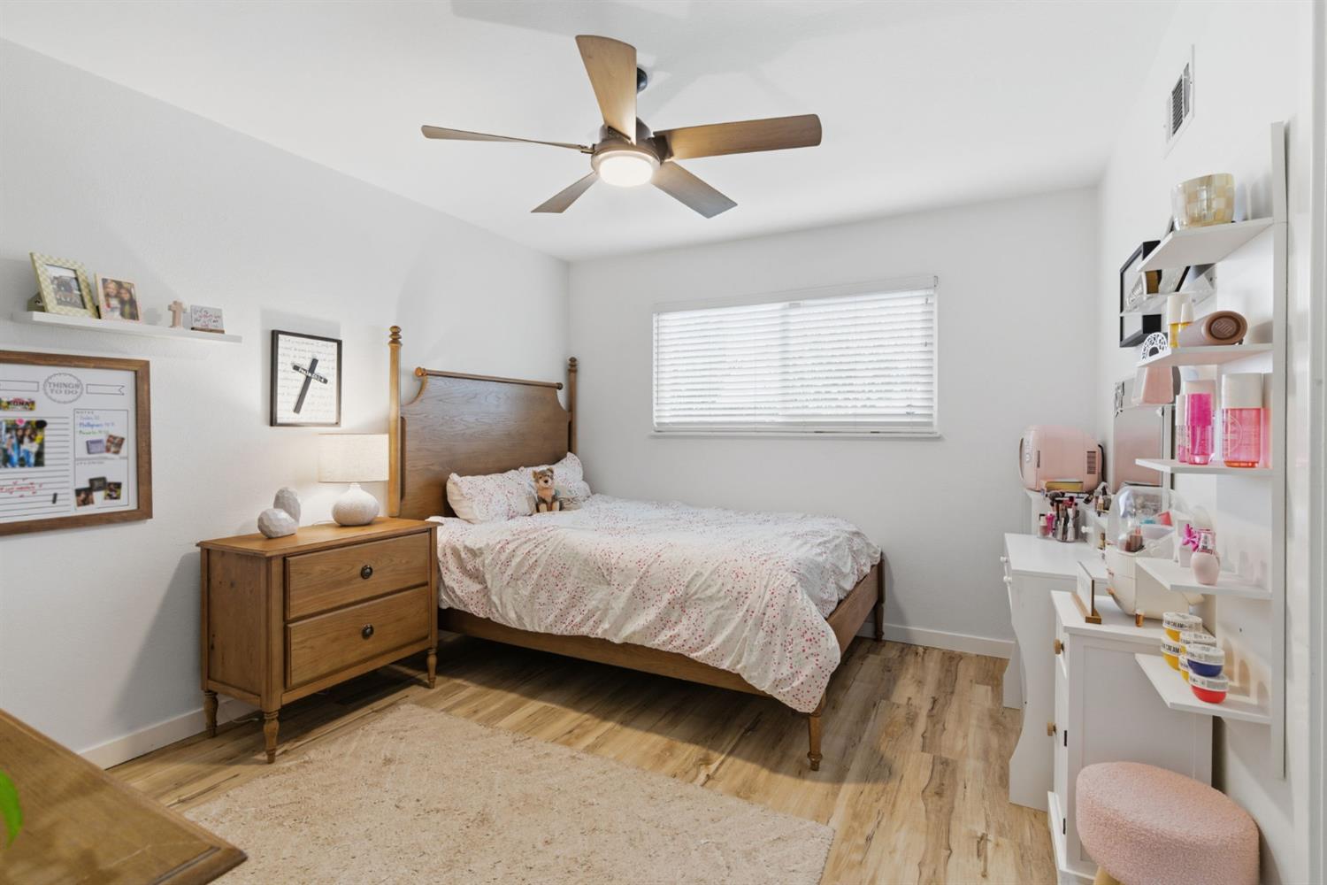 15581 French Camp Road Ripon, CA 95366 - Photo 27 of 54 a bedroom with a bed and wooden floor