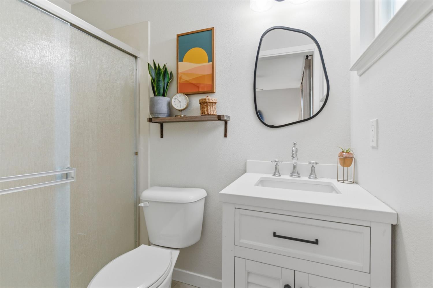 15581 French Camp Road Ripon, CA 95366 - Photo 30 of 54 a bathroom with a toilet sink and mirror