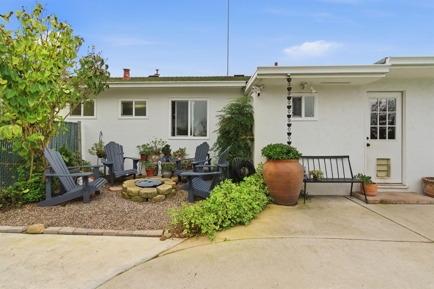 15581 French Camp Road Ripon, CA 95366 - Photo 31 of 54 a view of a patio with table and chairs potted plants and a large tree