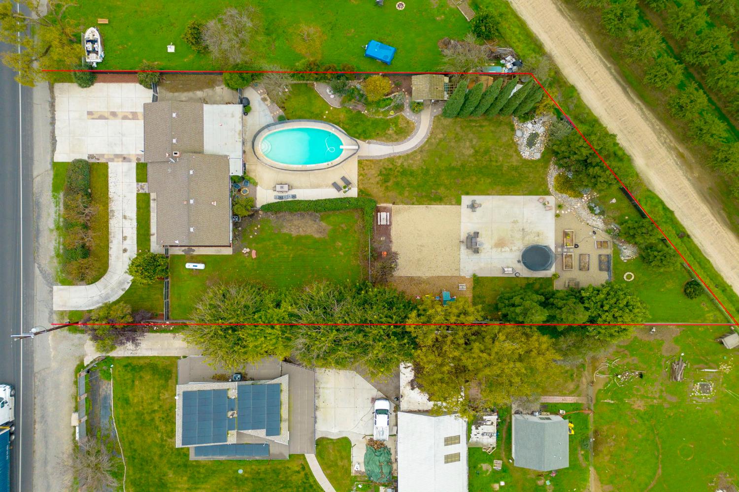 15581 French Camp Road Ripon, CA 95366 - Photo 5 of 54 an aerial view of a house with a swimming pool