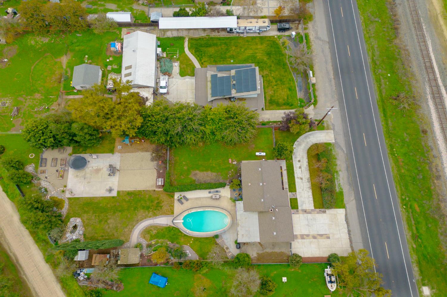 15581 French Camp Road Ripon, CA 95366 - Photo 51 of 54 aerial view of a house with pool patio and fire pit