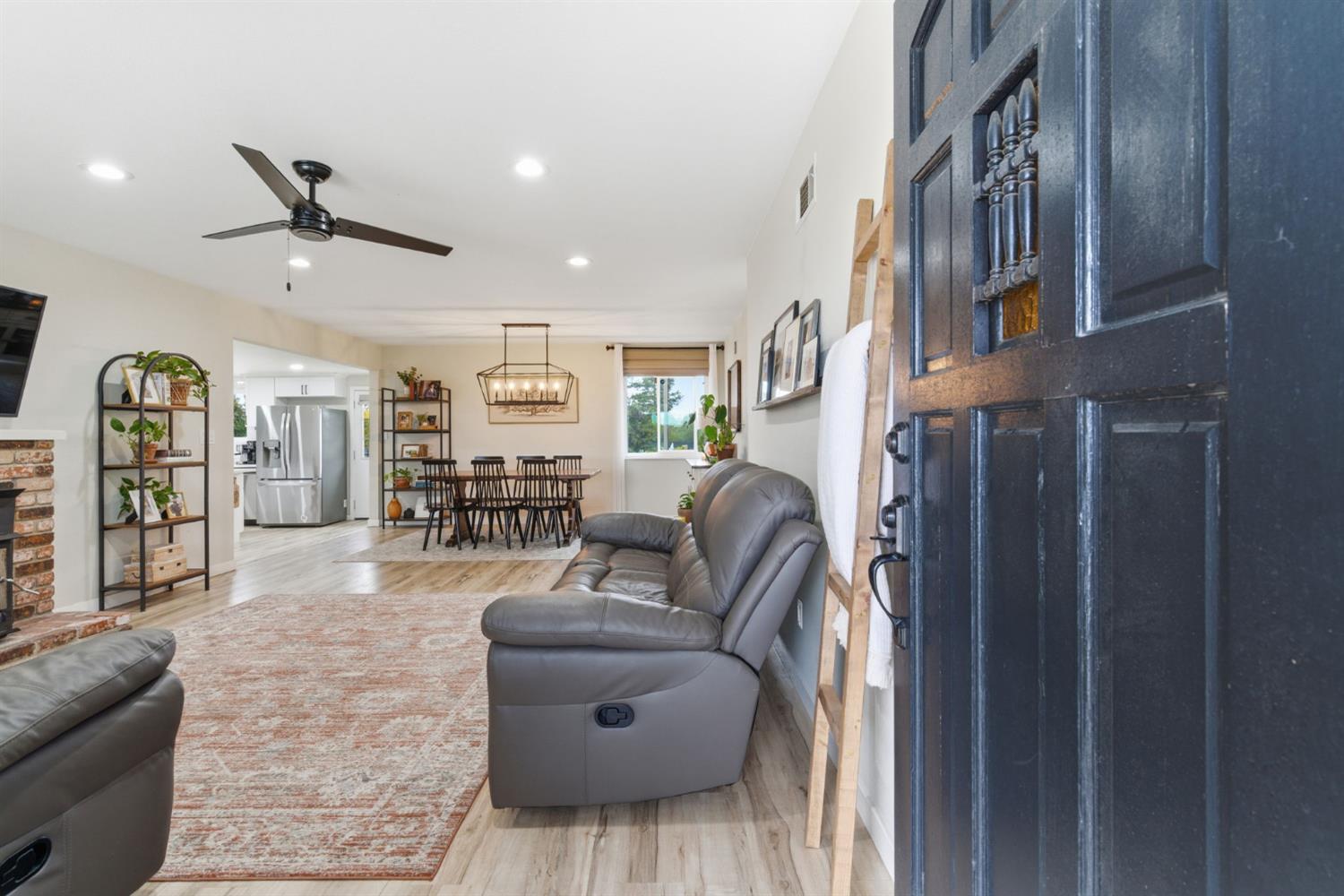 15581 French Camp Road Ripon, CA 95366 - Photo 7 of 54 a living room with furniture and wooden floor